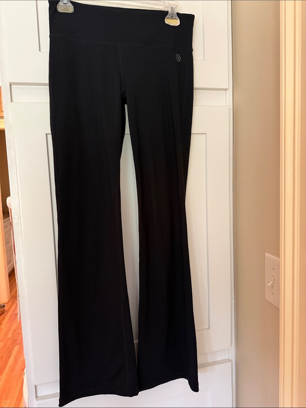 CAbi Black Boot-Cut Yoga Pants with Subtle Logo